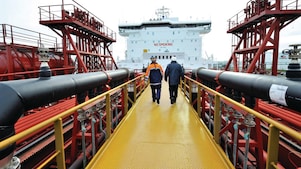 Employee walking along on a tanker