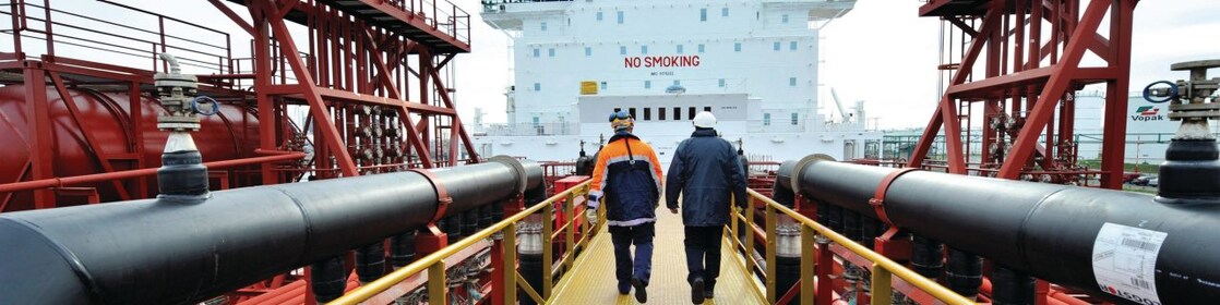 Employee walking along on a tanker