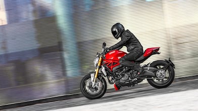 Man riding a bike which is using the Superior Engine Oil For Bikes