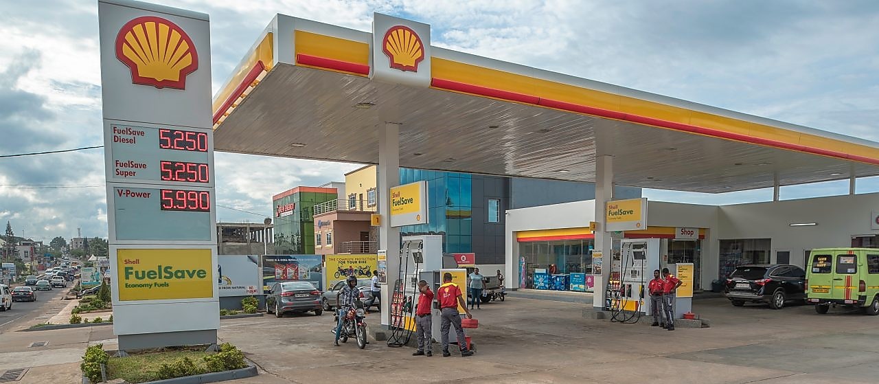 The forecourt of a shell service station at dusk