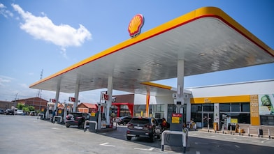 The forecourt of a shell service station at dusk