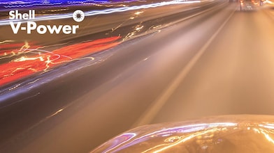 High-speed motion blur effect on highway with Shell V-Power branding