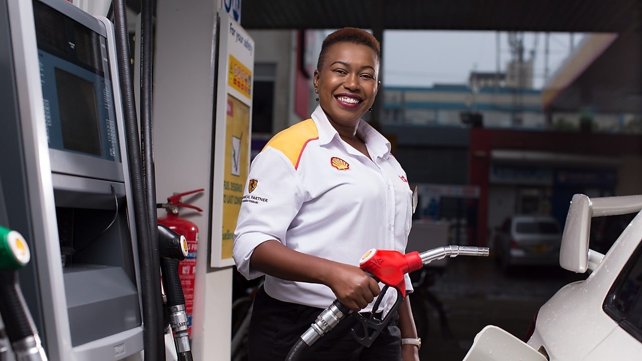 Man refueling his car at a petrol pump